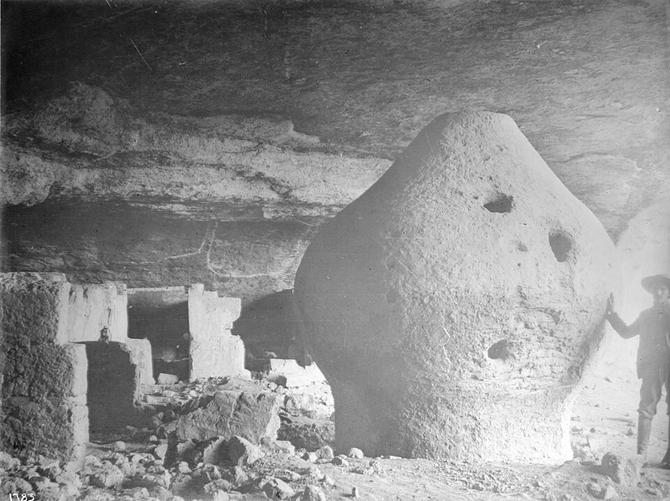 Man standing next to a granary of the Indian cliff dwellings, Sierra Madre, Mexico, ca.1900 (CHS-1783)