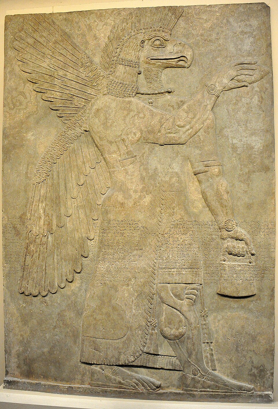 gallery:ae581326|verified:yes|Wall relief depicting an eagle-headed and winged man, Apkallu, from Nimrud