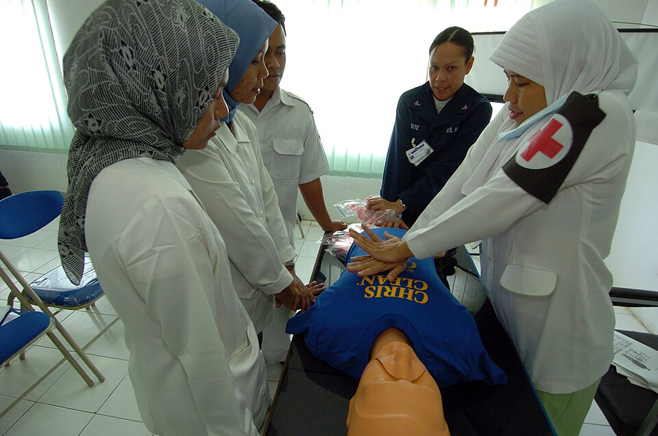 US Navy 050301-N-8629M-332 An Indonesian nurse practices cardio pulmonary resuscitation (CPR) under the instruction of Hospital Corpsman 3rd Class Lynette Shute